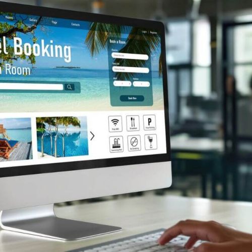 User browsing a hotel booking website on a desktop computer, illustrating key elements of digital experience, conversion optimisation, and performance analysis in a hotel digital marketing audit.